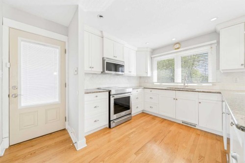 1728 Lake Bonavista Drive Se, Calgary, AB - Indoor Photo Showing Kitchen