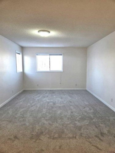 182 Coventry Close Ne, Calgary, AB - Indoor Photo Showing Bedroom