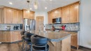 36 New Brighton Landing Se, Calgary, AB  - Indoor Photo Showing Kitchen With Stainless Steel Kitchen With Double Sink 