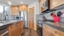 36 New Brighton Landing Se, Calgary, AB  - Indoor Photo Showing Kitchen With Stainless Steel Kitchen With Double Sink With Upgraded Kitchen 