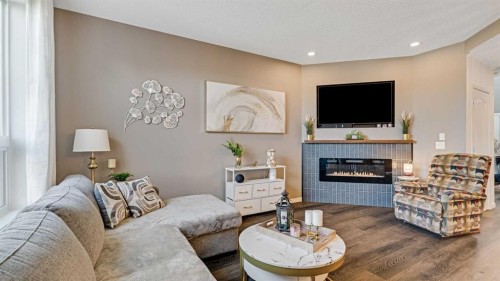 36 New Brighton Landing Se, Calgary, AB - Indoor Photo Showing Other Room With Fireplace