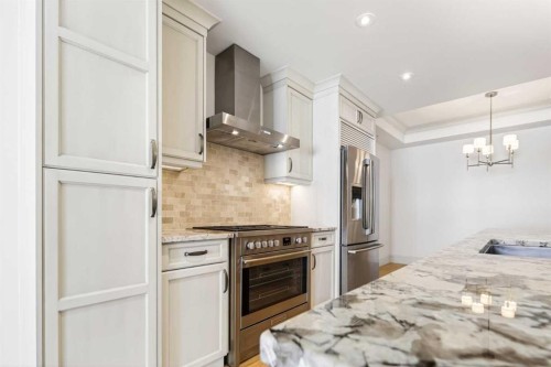 305-221 Quarry Way Se, Calgary, AB - Indoor Photo Showing Kitchen With Upgraded Kitchen