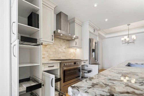 305-221 Quarry Way Se, Calgary, AB - Indoor Photo Showing Kitchen With Upgraded Kitchen