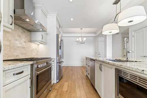 305-221 Quarry Way Se, Calgary, AB - Indoor Photo Showing Kitchen With Upgraded Kitchen