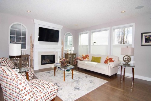 237 Kinniburgh Way, Chestermere, AB - Indoor Photo Showing Living Room With Fireplace