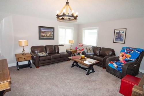 237 Kinniburgh Way, Chestermere, AB - Indoor Photo Showing Living Room