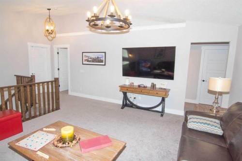 237 Kinniburgh Way, Chestermere, AB - Indoor Photo Showing Living Room