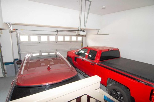 237 Kinniburgh Way, Chestermere, AB - Indoor Photo Showing Garage