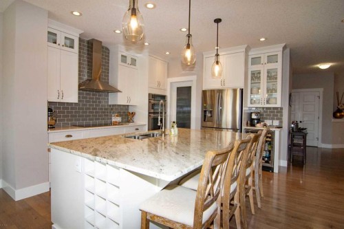 237 Kinniburgh Way, Chestermere, AB - Indoor Photo Showing Kitchen With Double Sink With Upgraded Kitchen