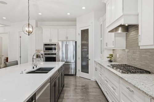117 Spring Water Close, Heritage Pointe, AB - Indoor Photo Showing Kitchen With Double Sink With Upgraded Kitchen