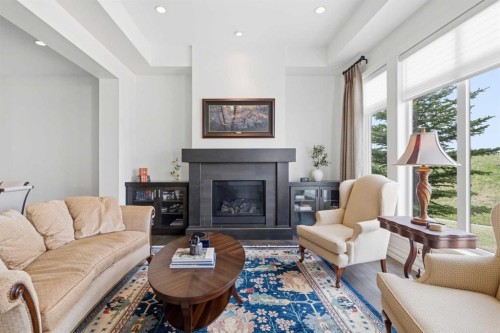 117 Spring Water Close, Heritage Pointe, AB - Indoor Photo Showing Living Room With Fireplace