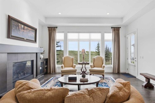 117 Spring Water Close, Heritage Pointe, AB - Indoor Photo Showing Living Room With Fireplace