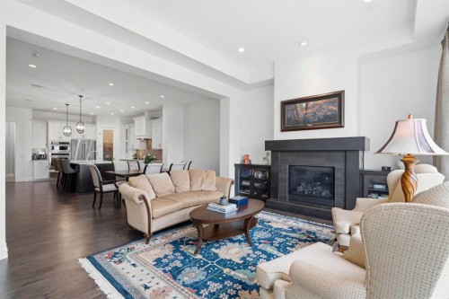 117 Spring Water Close, Heritage Pointe, AB - Indoor Photo Showing Living Room With Fireplace