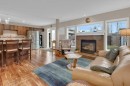 15 New Brighton Manor Se, Calgary, AB  - Indoor Photo Showing Living Room With Fireplace 