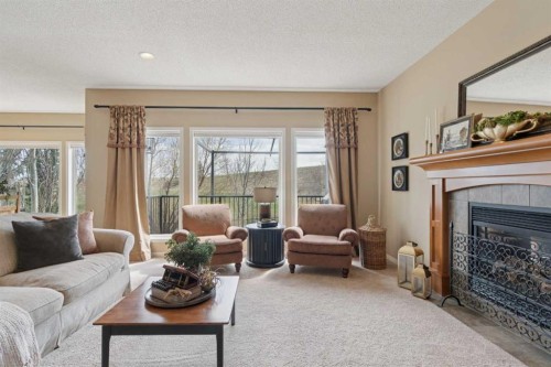 59 Heritage Cove, Heritage Pointe, AB - Indoor Photo Showing Living Room With Fireplace