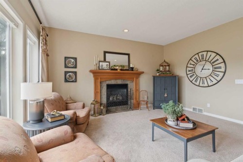 59 Heritage Cove, Heritage Pointe, AB - Indoor Photo Showing Living Room With Fireplace