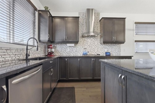 773 River Heights Crescent, Cochrane, AB - Indoor Photo Showing Kitchen With Upgraded Kitchen