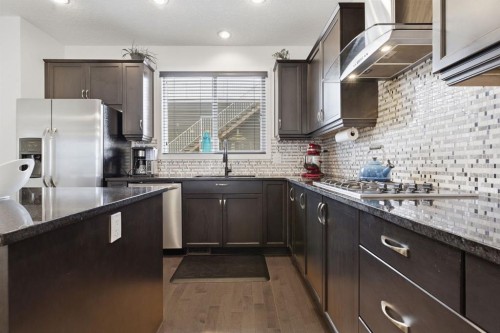 773 River Heights Crescent, Cochrane, AB - Indoor Photo Showing Kitchen With Stainless Steel Kitchen With Upgraded Kitchen