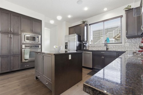 773 River Heights Crescent, Cochrane, AB - Indoor Photo Showing Kitchen With Stainless Steel Kitchen With Upgraded Kitchen