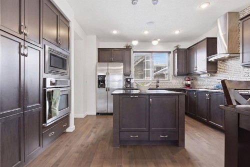773 River Heights Crescent, Cochrane, AB - Indoor Photo Showing Kitchen With Upgraded Kitchen