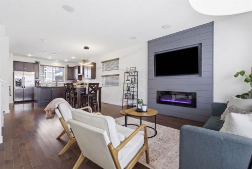 773 River Heights Crescent, Cochrane, AB - Indoor Photo Showing Living Room With Fireplace
