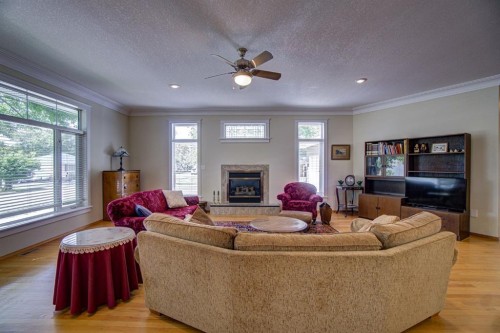 224 52 Avenue West, Claresholm, AB - Indoor Photo Showing Living Room With Fireplace