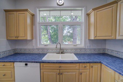 224 52 Avenue West, Claresholm, AB - Indoor Photo Showing Kitchen With Double Sink