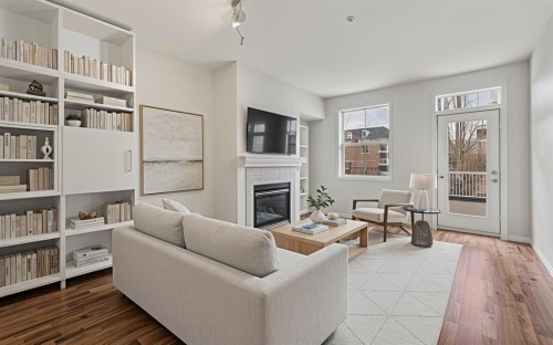 206-3651 Marda Link Sw, Calgary, AB - Indoor Photo Showing Living Room With Fireplace