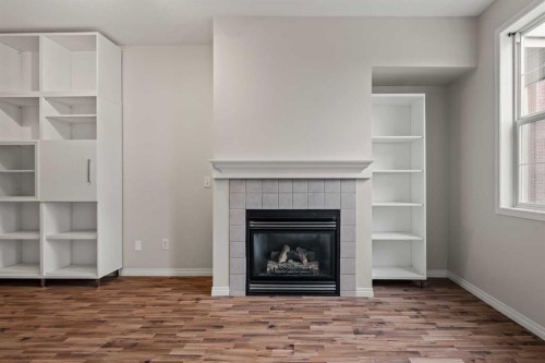 206-3651 Marda Link Sw, Calgary, AB - Indoor Photo Showing Living Room With Fireplace