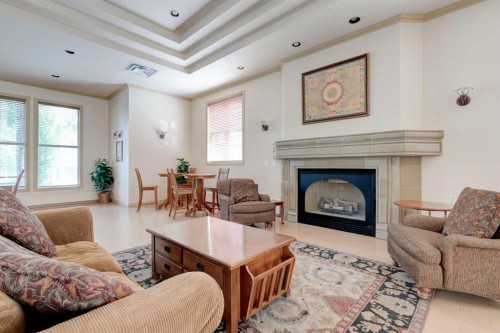 206-3651 Marda Link Sw, Calgary, AB - Indoor Photo Showing Living Room With Fireplace