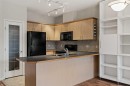 206-3651 Marda Link Sw, Calgary, AB  - Indoor Photo Showing Kitchen With Double Sink 