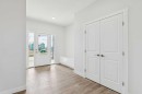 10 Quartz Gate, Balzac, AB  - Indoor Photo Showing Living Room With Fireplace 