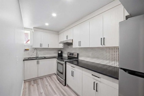 233 Aspenmere Circle, Chestermere, AB - Indoor Photo Showing Kitchen With Upgraded Kitchen