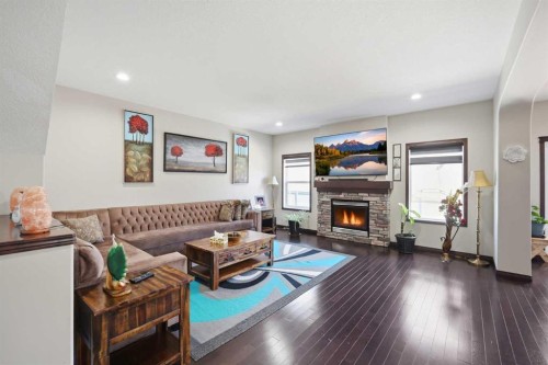 233 Aspenmere Circle, Chestermere, AB - Indoor Photo Showing Living Room With Fireplace