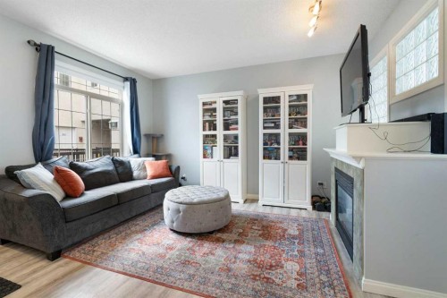 210-5703 5 Street Sw, Calgary, AB - Indoor Photo Showing Living Room
