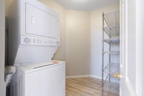 210-5703 5 Street Sw, Calgary, AB - Indoor Photo Showing Laundry Room