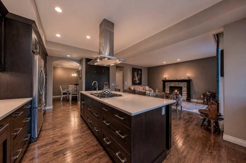 23 Aspen Summit Mount Sw, Calgary, AB - Indoor Photo Showing Kitchen With Fireplace