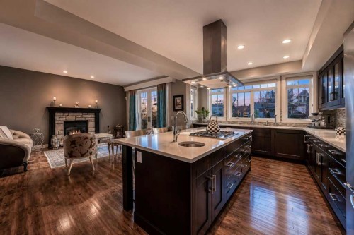 23 Aspen Summit Mount Sw, Calgary, AB - Indoor Photo Showing Kitchen With Fireplace