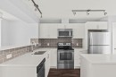4 Evanscrest Gardens Nw, Calgary, AB  - Indoor Photo Showing Kitchen With Stainless Steel Kitchen With Double Sink With Upgraded Kitchen 
