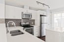 4 Evanscrest Gardens Nw, Calgary, AB  - Indoor Photo Showing Kitchen With Stainless Steel Kitchen With Double Sink With Upgraded Kitchen 
