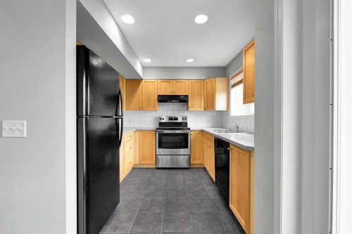 164 Bridleridge Gardens Sw, Calgary, AB - Indoor Photo Showing Kitchen