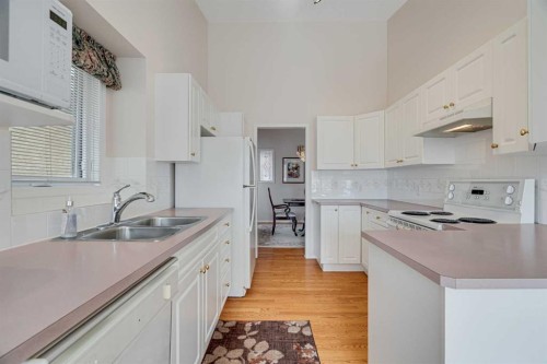 58 Evergreen Bay Sw, Calgary, AB - Indoor Photo Showing Kitchen With Double Sink