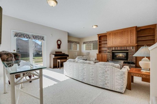 58 Evergreen Bay Sw, Calgary, AB - Indoor Photo Showing Living Room With Fireplace
