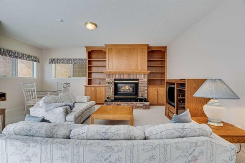 58 Evergreen Bay Sw, Calgary, AB - Indoor Photo Showing Living Room With Fireplace