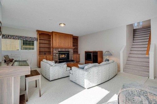 58 Evergreen Bay Sw, Calgary, AB - Indoor Photo Showing Living Room With Fireplace