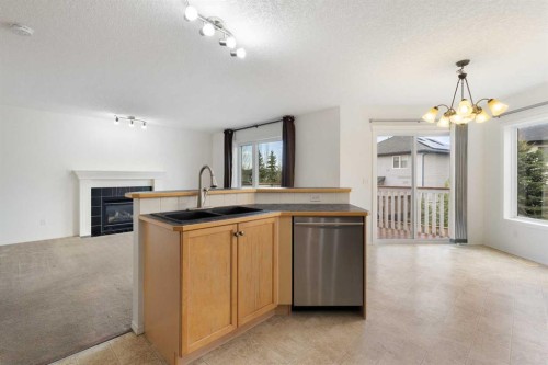 112 Everridge Drive Sw, Calgary, AB - Indoor With Fireplace