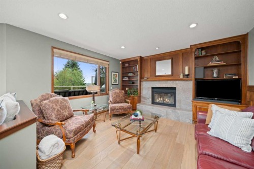 527 Scimitar Bay Nw, Calgary, AB - Indoor Photo Showing Living Room With Fireplace