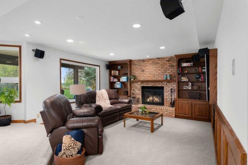 527 Scimitar Bay Nw, Calgary, AB - Indoor Photo Showing Living Room With Fireplace