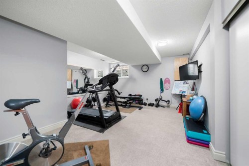 527 Scimitar Bay Nw, Calgary, AB - Indoor Photo Showing Gym Room