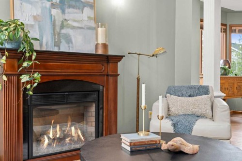 527 Scimitar Bay Nw, Calgary, AB - Indoor Photo Showing Living Room With Fireplace